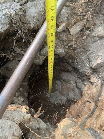 digging wholes and measuring for depth